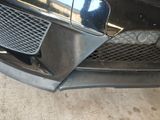 a close up of a car ' s front bumper and grille