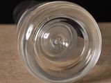 a close up of a wine glass on a table