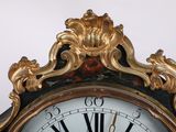 a clock that has roman numerals on the face of it