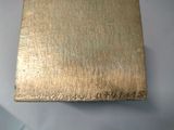 a metal box with a gold paint on it