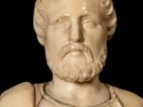 a marble bust of a man with a beard