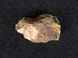 a close up of a rock on a black surface