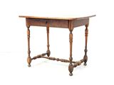 a small wooden table with a drawer on top of it