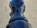 a black motorcycle parked on the side of the road