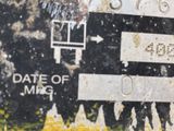 a close up of a street sign with a lot of signs on it