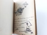 an open book with a drawing of a boy riding a bike
