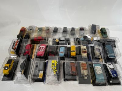 a lot of toy cars in plastic bags on a table