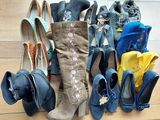 many pairs of shoes that are lined up on the floor