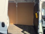 a white van with the door open in a parking lot
