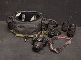 a camera and a camera bag on the ground