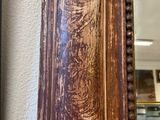 an old mirror hanging on the wall in a room
