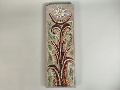 a close up of a piece of art with a star on it