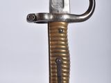 a close up of a knife hanging on a wall