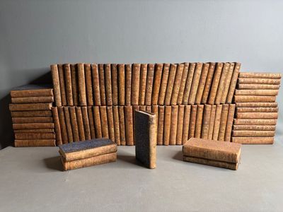 several books stacked on top of each other on a table