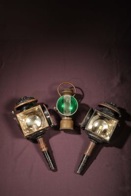 three small lights are sitting on top of a purple surface