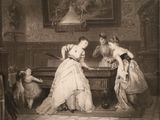 two women playing a game of cards in a room