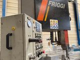 a picture of a machine in a factory with a sign on it