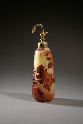 an image of a glass bottle with flowers on it