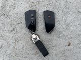 two remotes that are laying on the ground