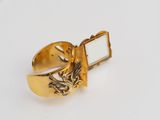an image of a gold ring with a picture of a dragon on it