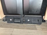 two black ovens that are sitting on the floor