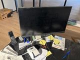 an image of a desk with a computer monitor and a cell phone