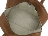 the inside of a brown purse with a zipper on it