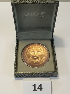 an image of a gold coin with a lion head on it
