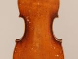 an antique violin with a wooden back and a wooden case