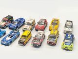 a lot of toy cars that are lined up together