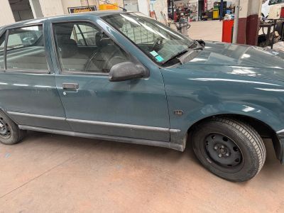 a blue car that is parked in a garage