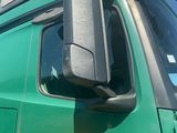 a green truck with a yellow z logo on the side