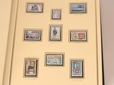 an open book with a bunch of stamps on it