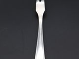 a fork and knife sitting on top of a black table