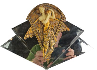 a mirror with a picture of an angel on it