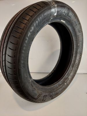 a close up of a tire on a white surface