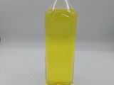a bottle of liquid that is sitting on a table