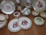 many plates and cups and saucers on the table
