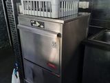 a silver dishwasher sitting next to a sink in a kitchen
