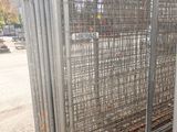 a fence that has a bunch of metal bars on it