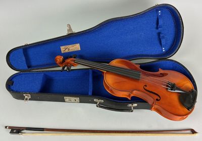 a violin in a case with a bow in it