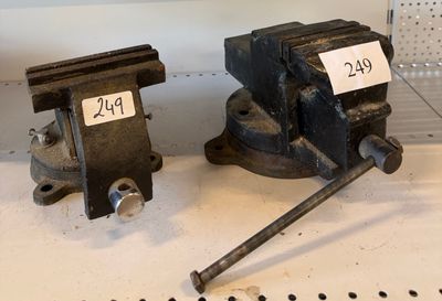 two vises that are sitting on a table