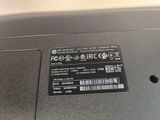 a close up of a laptop with a sticker on it