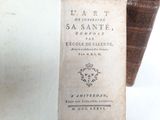 an old book sitting on top of a wooden table