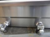 two stainless steel handles on the side of the oven
