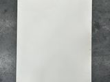 a white piece of paper sitting on top of a table