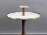 a white marble topped table on a pedestal with a wooden base