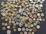 some coins are scattered on a table with a price tag