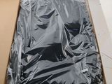 a box with a black shirt in it on the floor