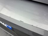 a close up of a car ' s bumper with a sticker on it